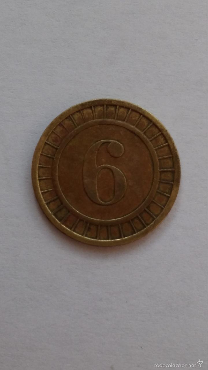 Moedas locais: Ficha ,moneda ,podria ser de casino con un 6 solo por una cara