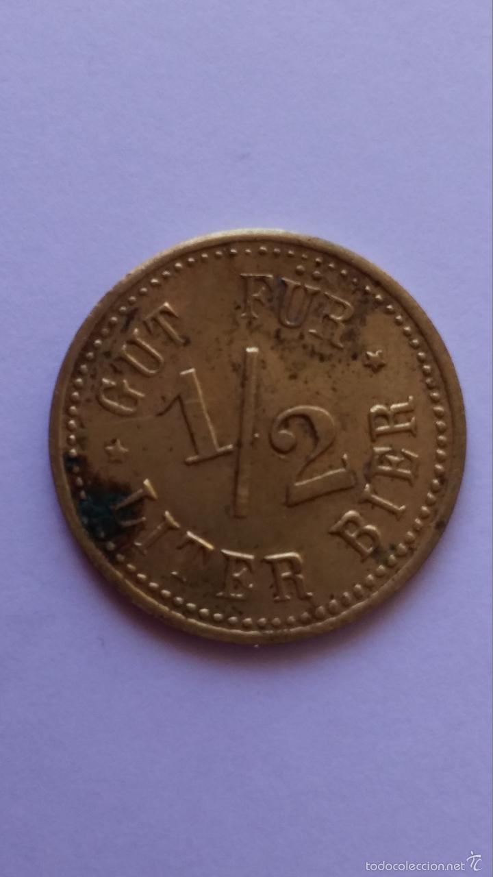 Moedas locais: Ficha ,moneda alemana,vale por medio litro de cerveza