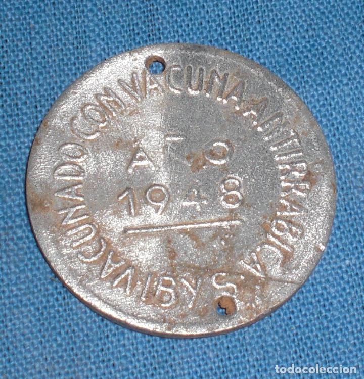 Monedas locales: Ficha antirrabica 1948 Instituto ibys Madrid - Foto 1
