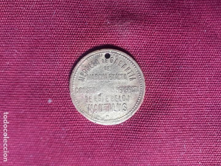 Monedas locales: FICHA RELOJ NAUTILUS A&Ntilde;OS 20 - Foto 1