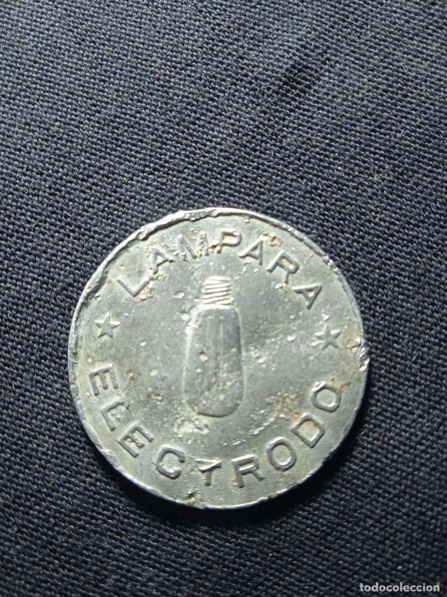 Monedas locales: Antigua ficha l&aacute;mpara Electrodo. - Foto 1