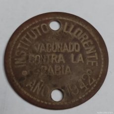 Monedas locales: ANTIGUA FICHA VACUNADO CONTRA LA RABIA 1942