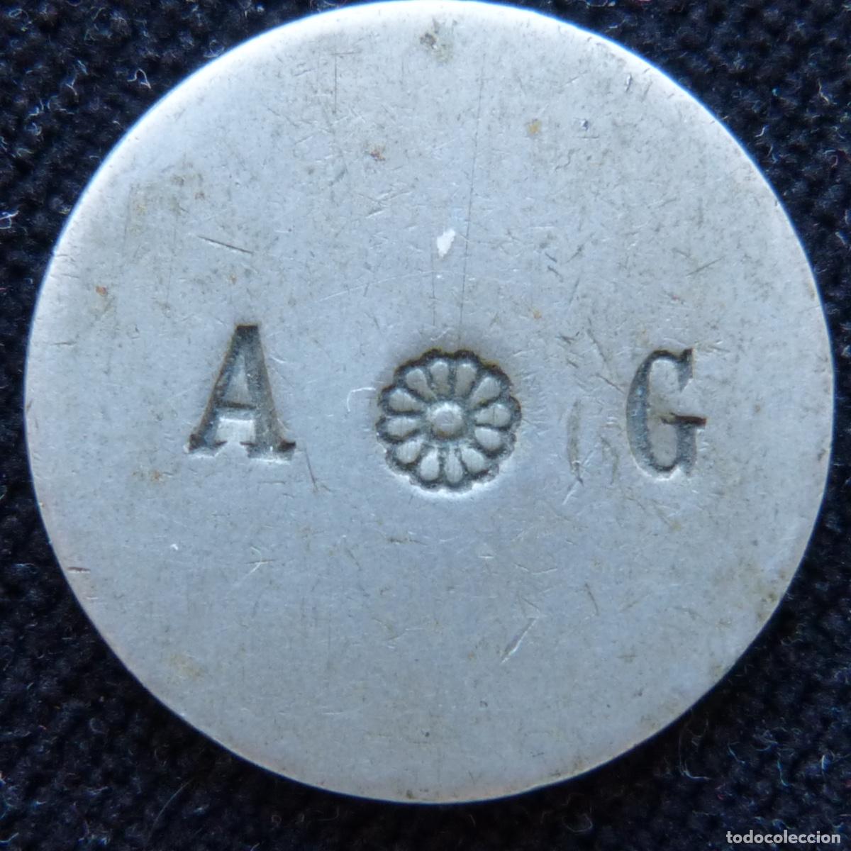 Monedas locales: Antigua ficha o moneda provisional, iniciales A G, 27mm, 9,34gr, provine de Gata de Gorgos.