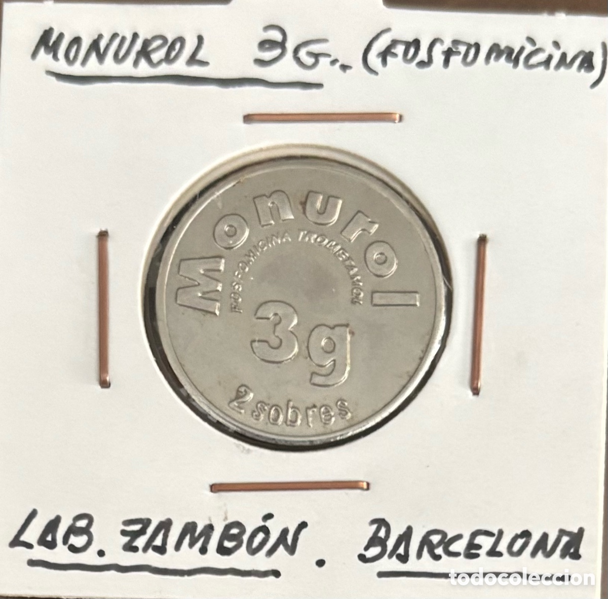 Monedas locales: Monurol 3 gramos. Publicidad medicamento
