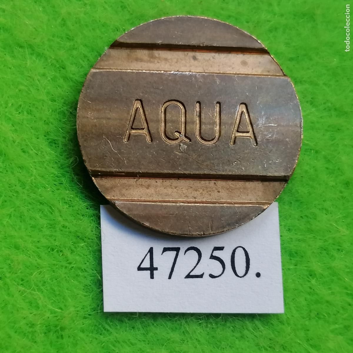 Monedas locales: ficha ranurada, AQUA, color cobre, token, jet&oacute;n