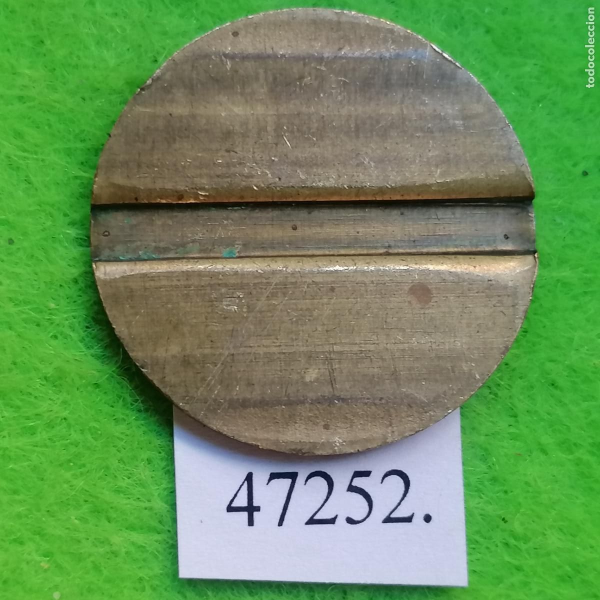 Monedas locales: ficha ranurada, token, jet&oacute;n