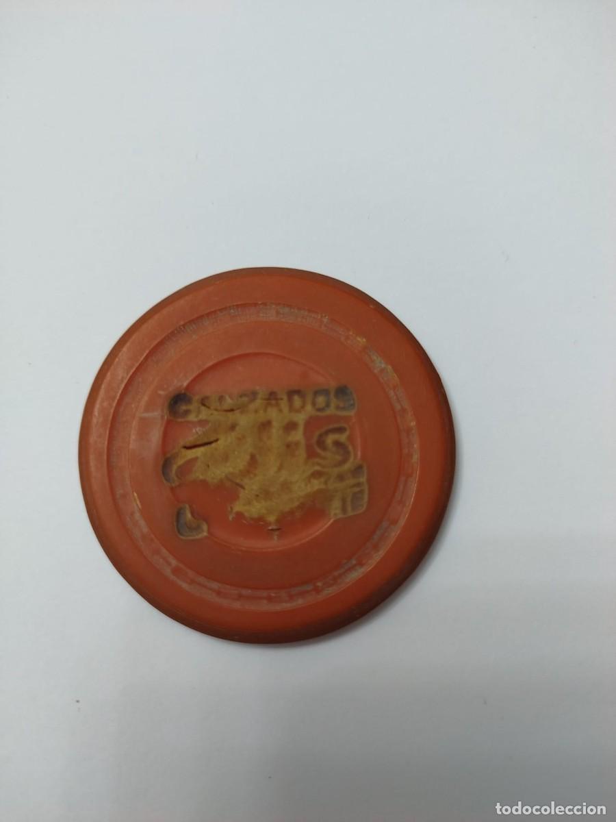Monedas locales: FICHA DE CALZADOS PLASTICO 100.