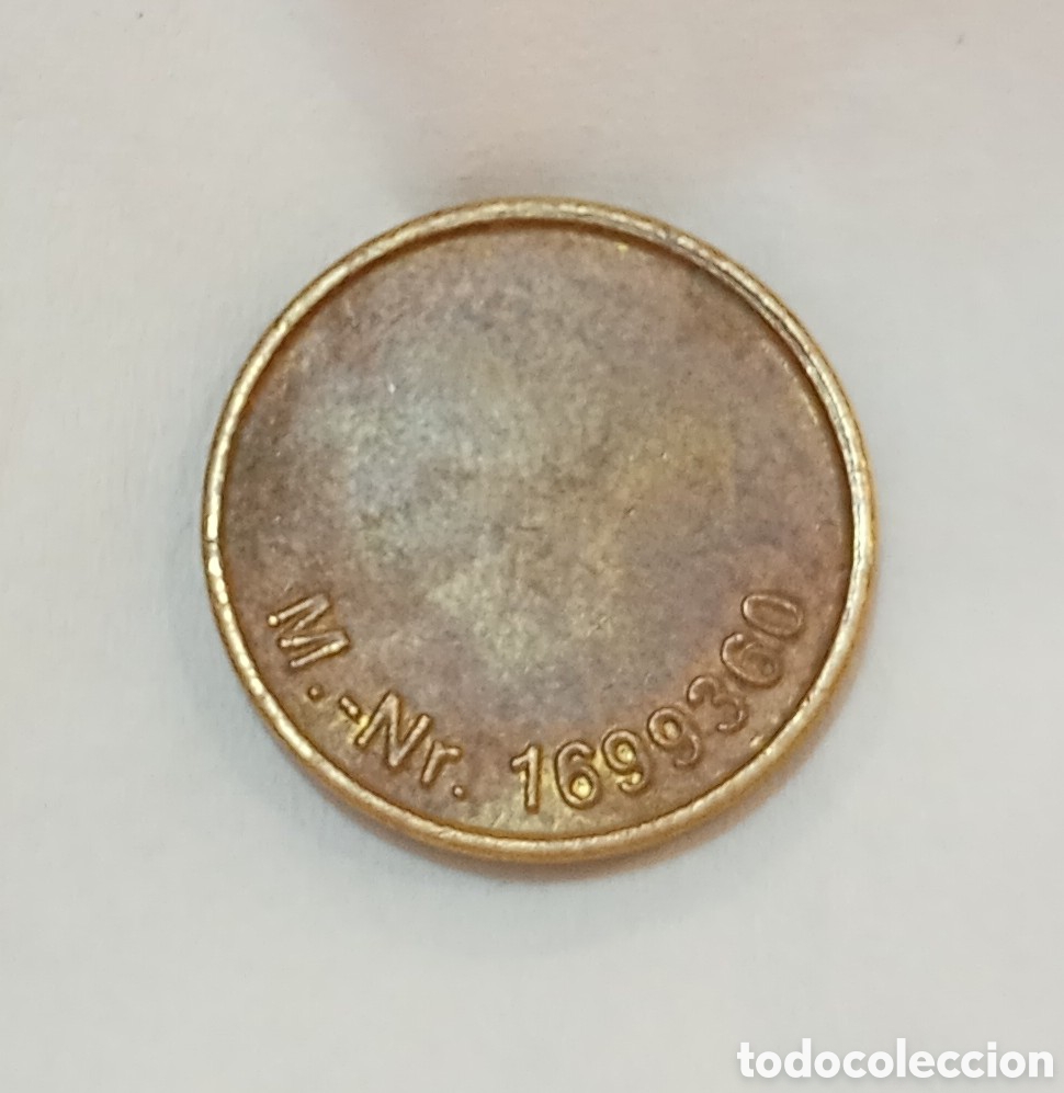 Monedas locales: Ficha a identificar, met&aacute;lica de probable uso comercial