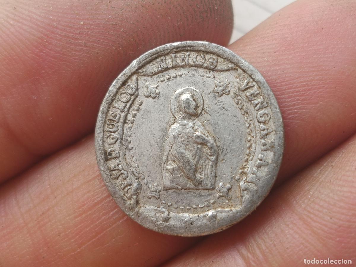 Monedas locales: Ficha parroquial de 5 c&eacute;ntimos