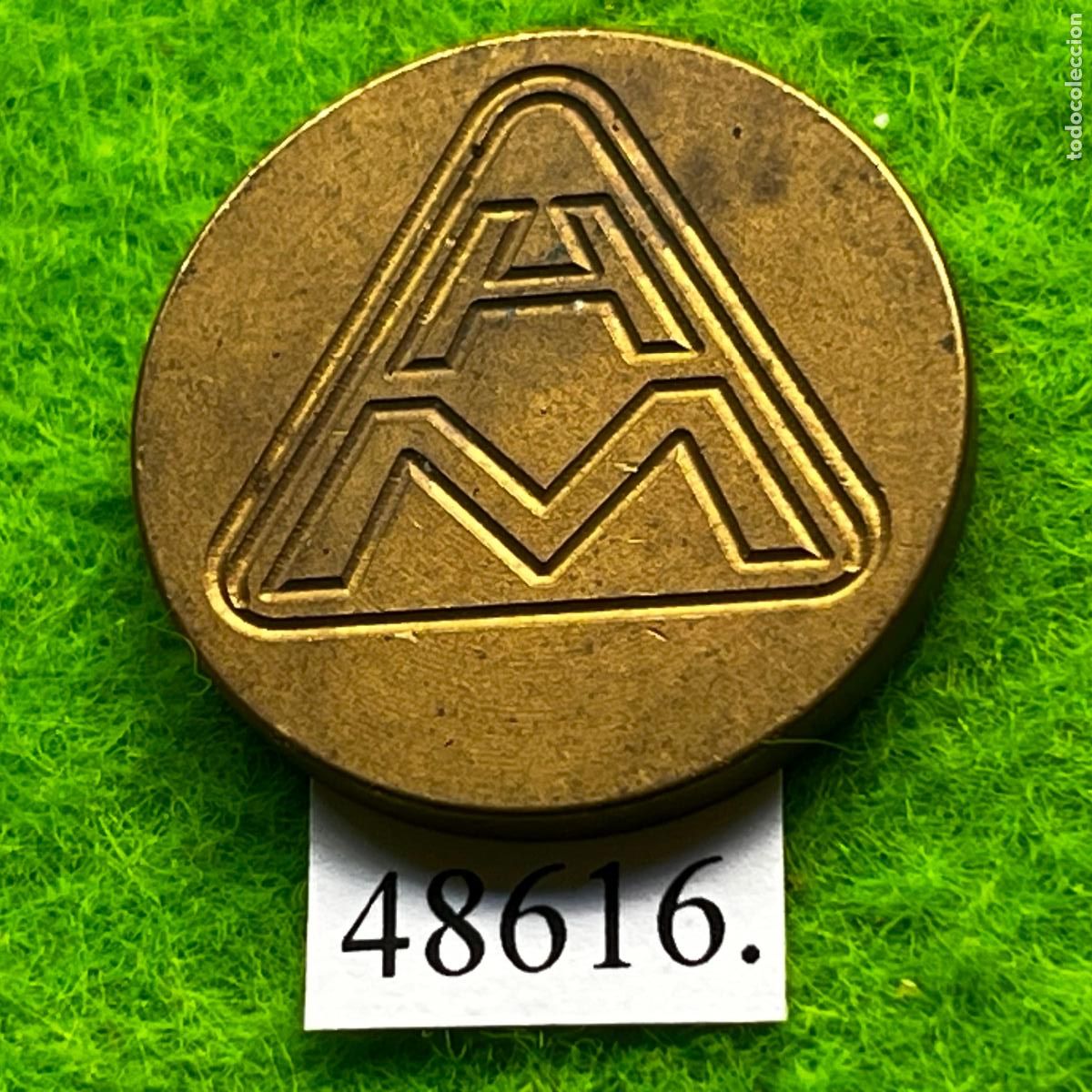 Monedas locales: ficha H M, token, jet&oacute;n