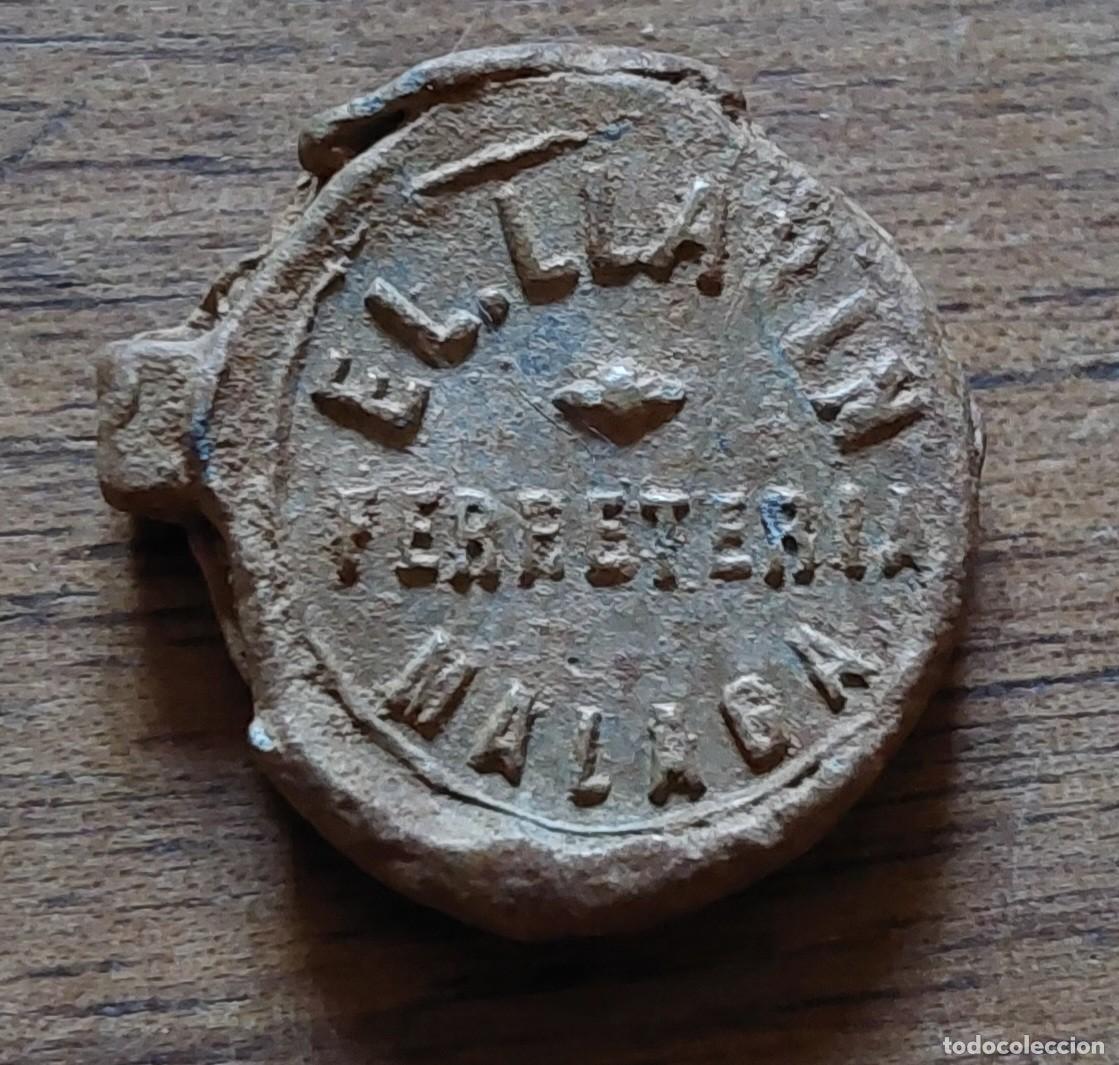 Monedas locales: Plomo marchamo Ferreter&iacute;a el Llavin Malaga