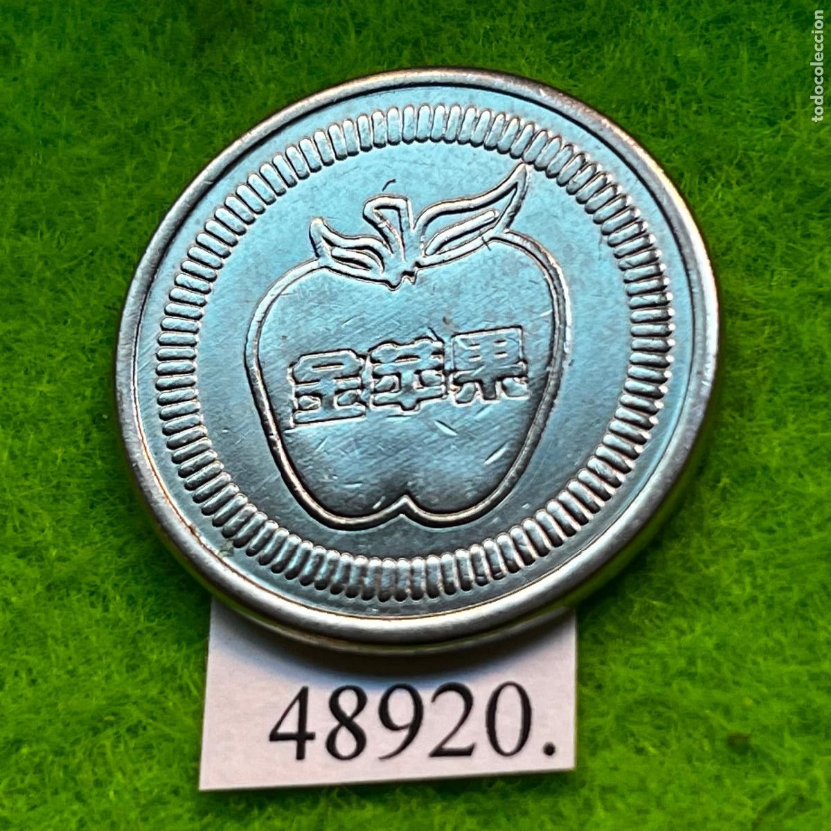 Monedas locales: ficha Hong Kong, China, Apple, Arcade, juegos recreativos, token, jet&oacute;n