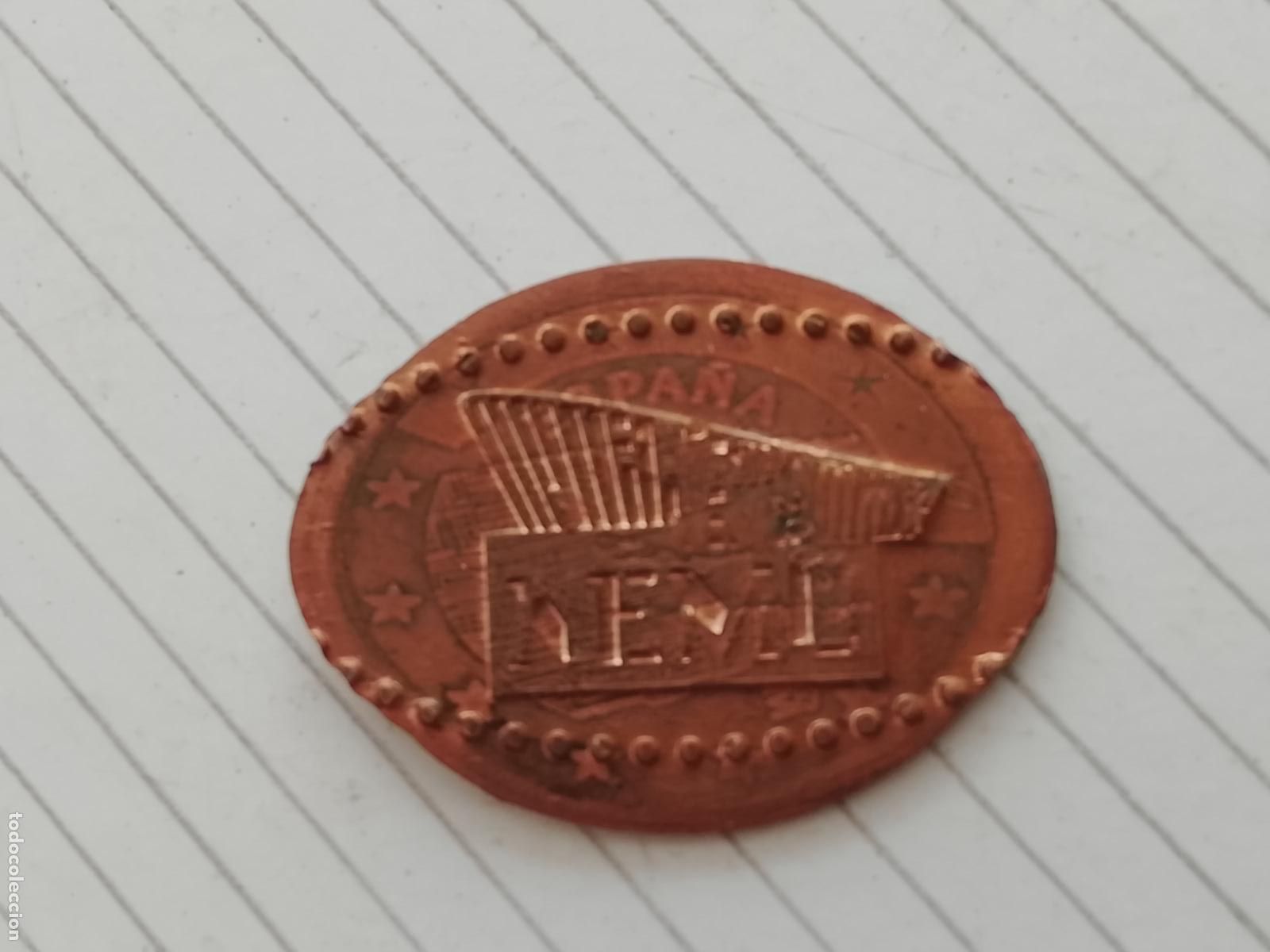 Monedas locales: Token / ficha enlongada. NEMO