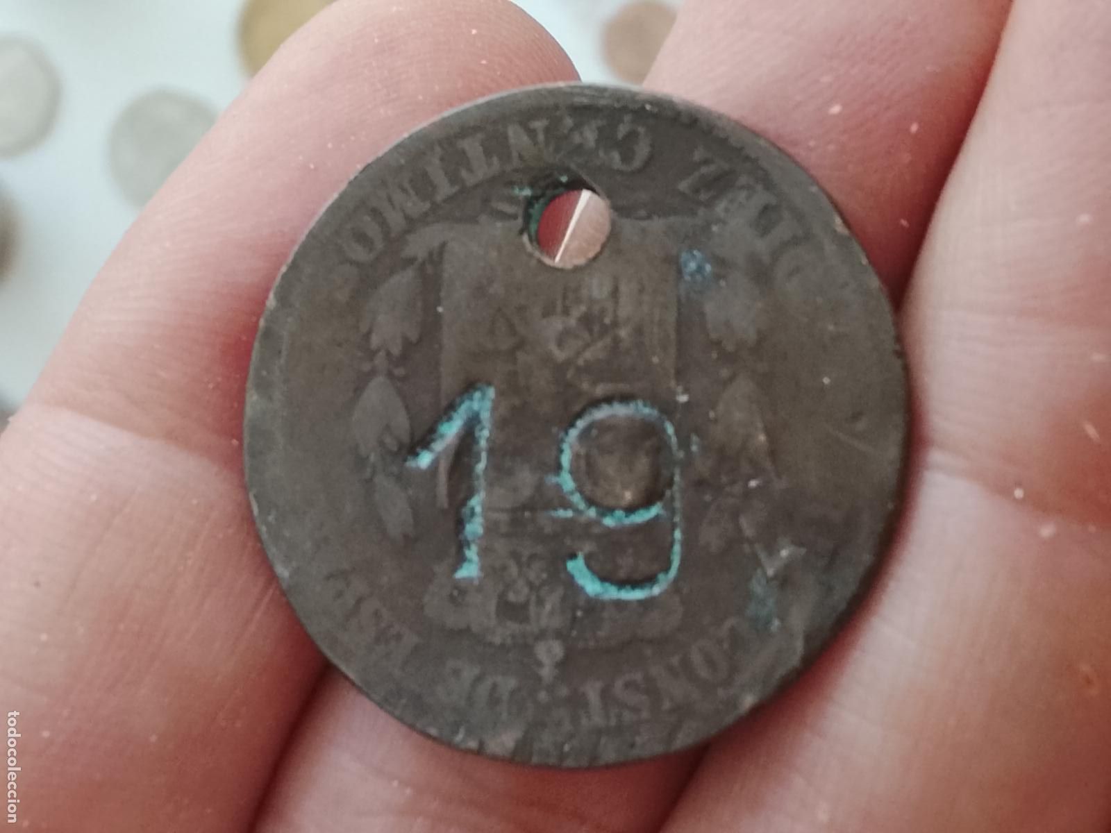 Local Coins: Ficha numeral 19 en 10 c&eacute;ntimos de Alfonso XII Posible ficha de guardarropa