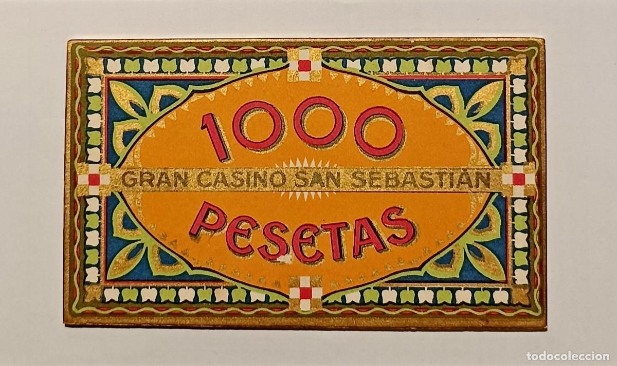 Moedas locais: FICHA 1000 PESETAS NARANJA DEL GRAN CASINO DE SAN SEBASTIAN