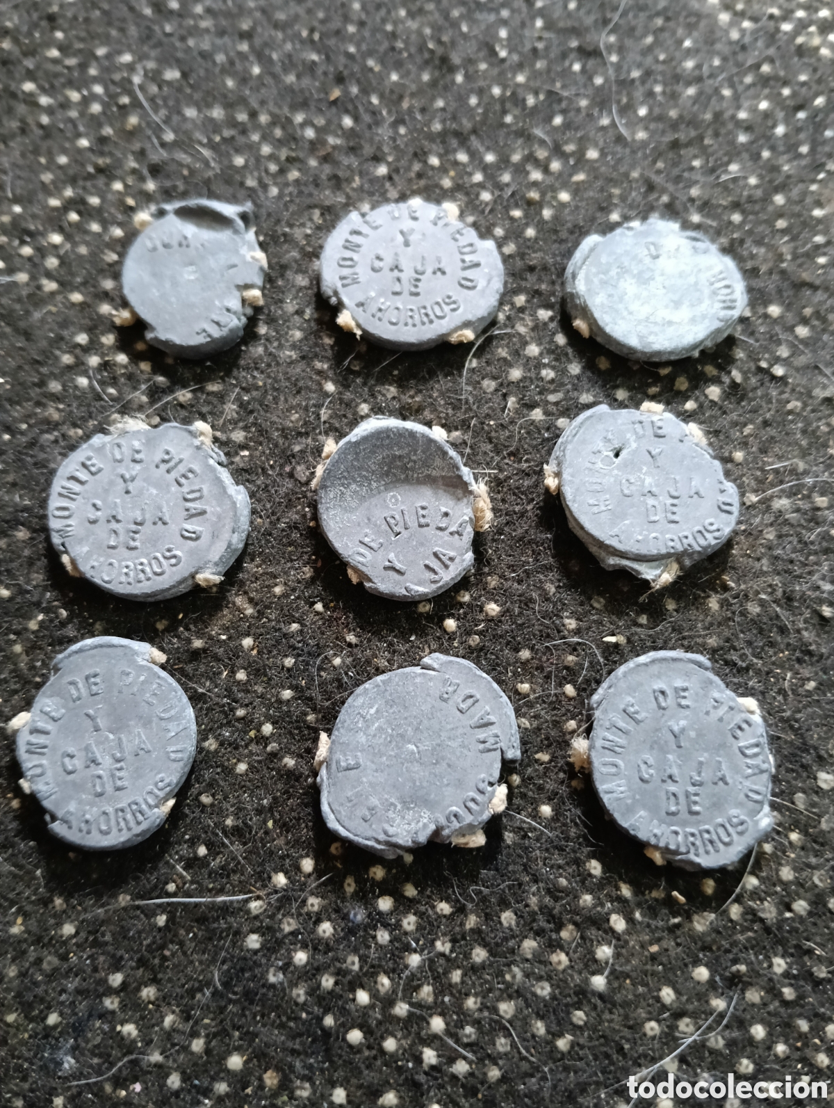 Monedas locales: Lote de 9 marchamos o plomos de precinto del Monte de Piedad y Caja de Ahorros de Sevilla, Madrid,