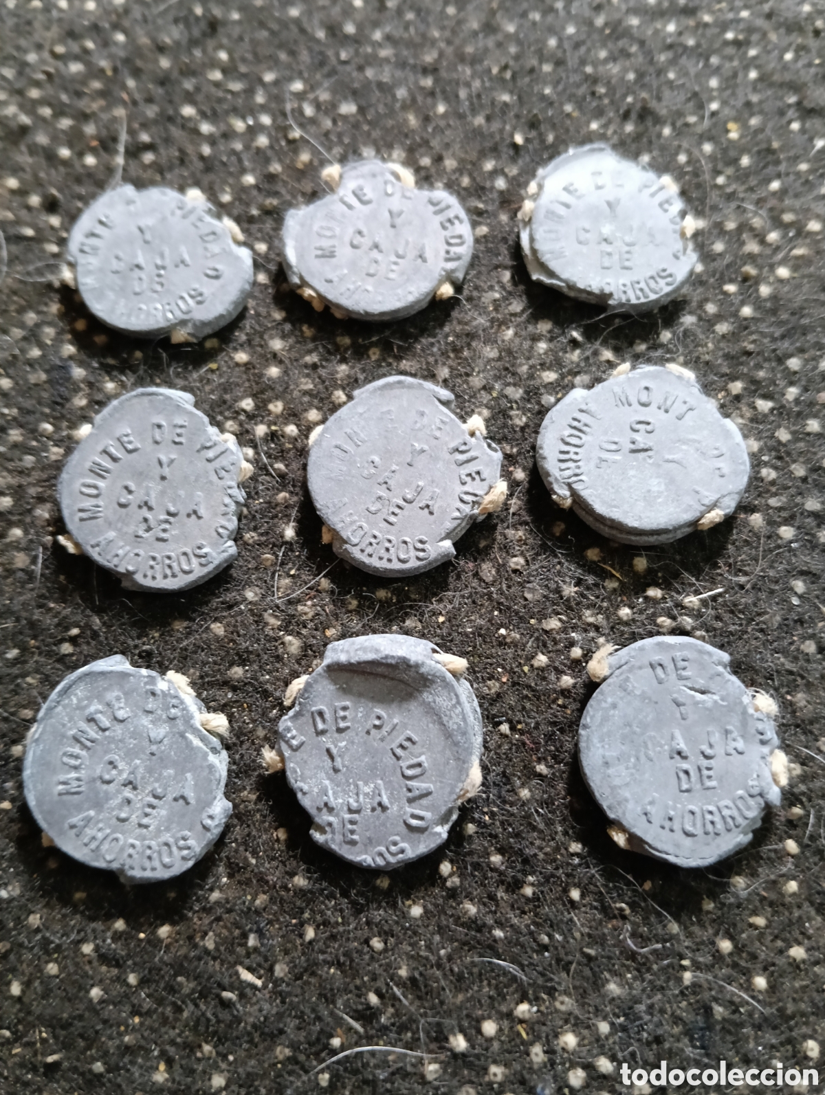 Monedas locales: Lote de 9 marchamos o plomos de precinto del Monte de Piedad y Caja de Ahorros de Sevilla, Madrid,