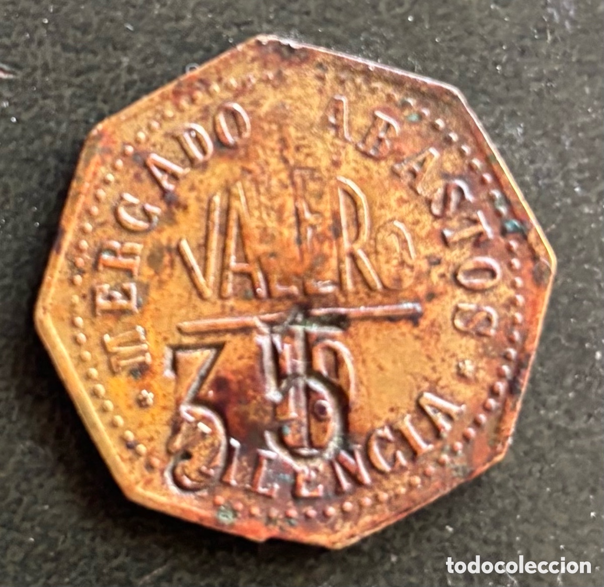 Monedas locales: Ficha monetaria. Valero. 10 ptas con resello 15. Abastos Valencia