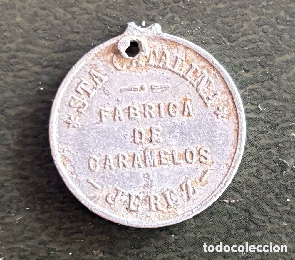 Monedas locales: Ficha monetaria. Jet&oacute;n F&aacute;brica de caramelos Sta Catalina en Jerez. Inmaculada