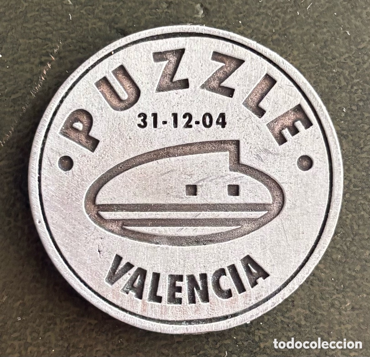 Monedas locales: Ficha monetaria. PUZZLE.2004. Valencia. 1 consumici&oacute;n