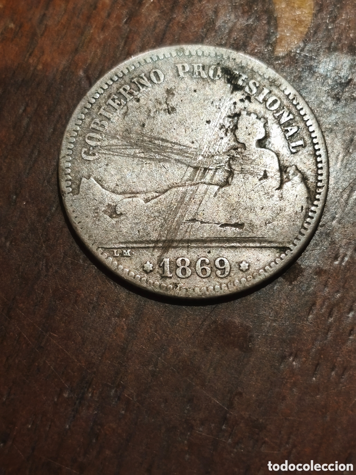 Monedas Rep&uacute;blica: Moneda de *Espa&ntilde;a de 1 pts de 1869 gastadita y rayada pero escasa ver