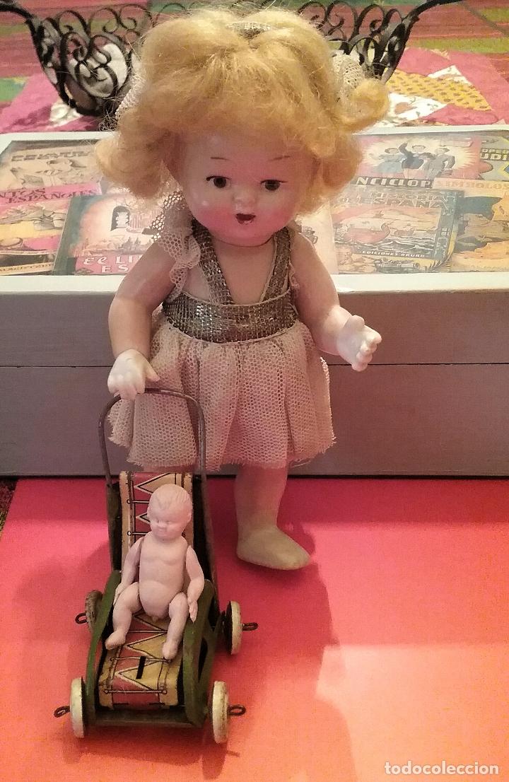 Mu&ntilde;eca espa&ntilde;ola clasica: MU&Ntilde;ECA DE CELULOIDE CON SILLA Y BEB&Eacute; - Foto 1