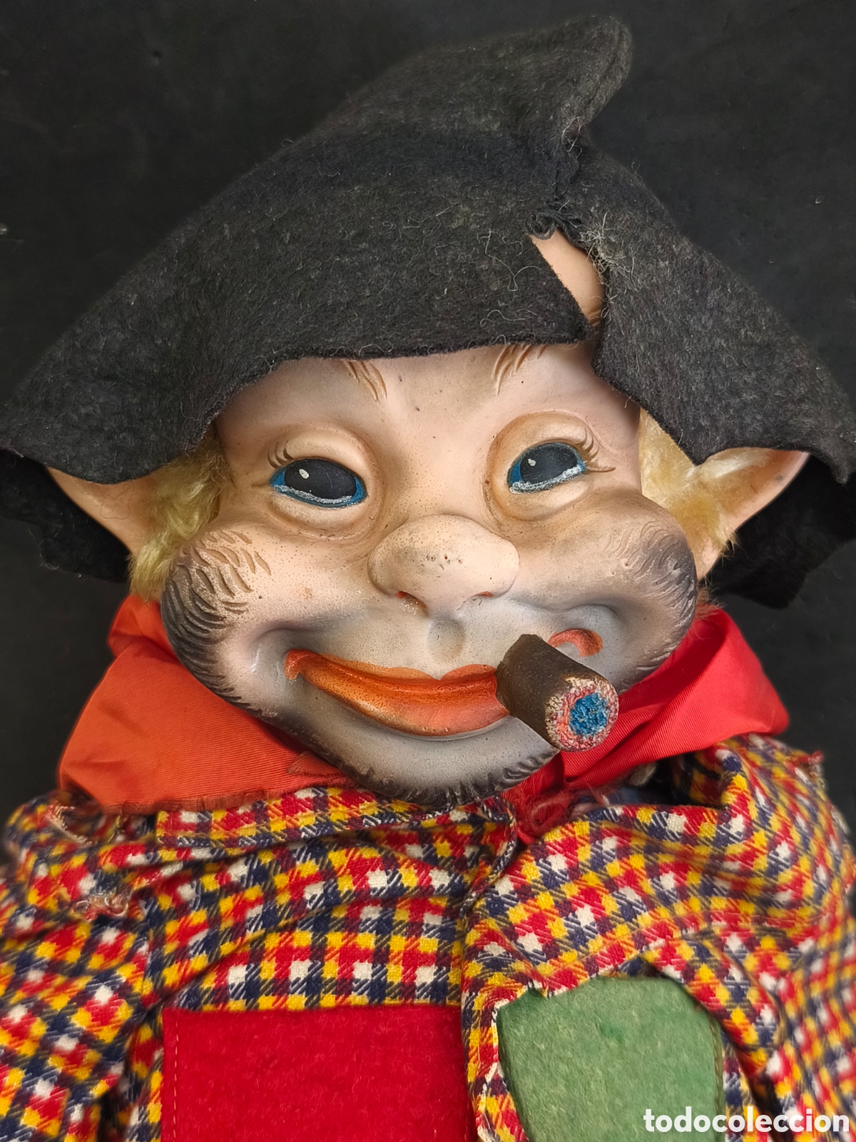 Mu&ntilde;ecas Extranjeras: Rushton, vagabundo con cara de goma, etiquetado como Rushton.