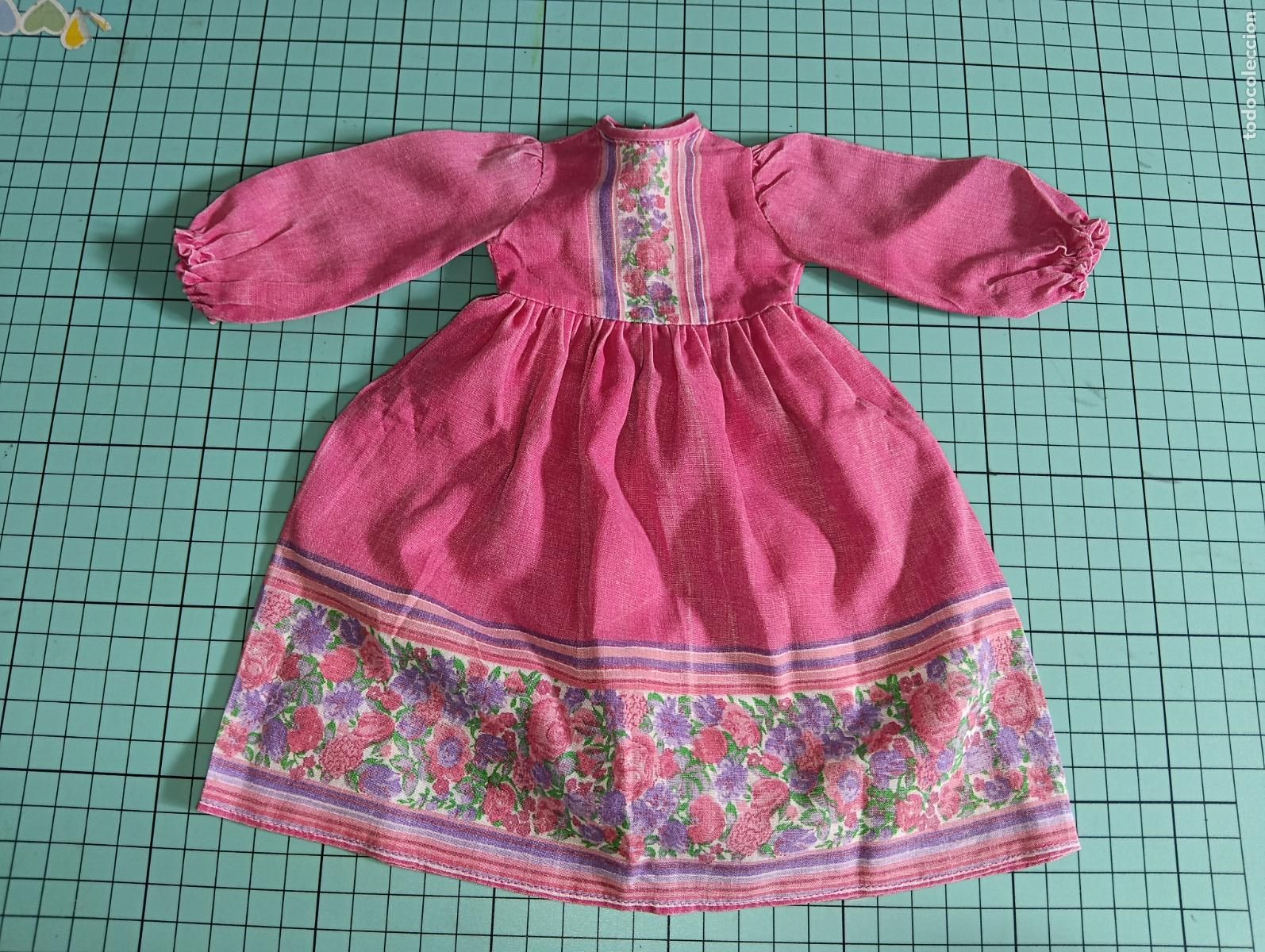 Mu&ntilde;ecas Nancy y Lucas: Vestido fucsia de mu&ntilde;eca Nancy