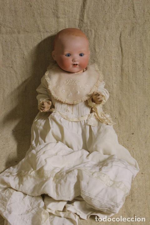 Mu&ntilde;ecas porcelana: Mu&ntilde;eco beb&eacute; de cara de porcelana.Cuerpo cart&oacute;n piedra.Fdo AM.Armand Marseille.Alemania.S XIX-XX.
