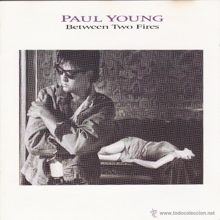 CDs de m&uacute;sica: PAUL YOUNG - BETWEEN TWO FIRES - compact disc.mirar portes antes de comprar - Foto 1