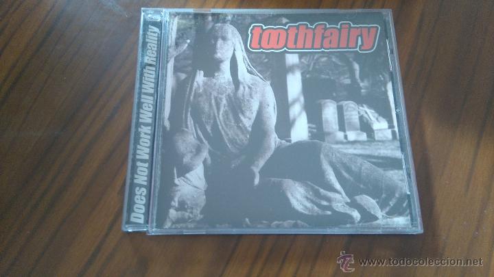 CDs de m&uacute;sica: TOOTHFAIRY. DOES NOT WORK WELL WITH REALITY. CD EN CAJA GRANDE 14 TEMAS. BUEN ESTADO