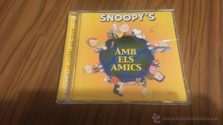 Musik-CDs: SNOOPY&acute;S. AMB ELS AMICS. CD EN CAJA GRANDE. CON 12 TEMAS. BUEN ESTADO. RARO