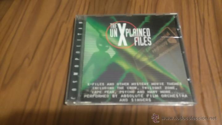 Musik-CDs: THE UN  XPLAINED FILES. CD EN CAJA GRANDE RECOPILATORIO CON 16 TEMAS. BUEN ESTADO