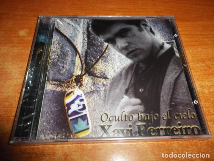Music CDs: XAVI FERREIRO Oculto bajo el cielo CD ALBUM PRECINTADO DEL A&Ntilde;O 1998 CONTIENE 12 TEMAS