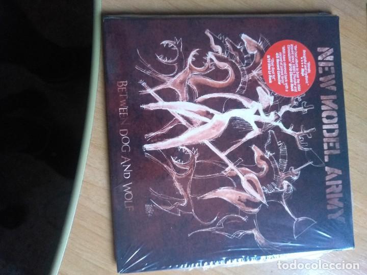 CDs de m&uacute;sica: NEW MODEL ARMY between dog and wolf NUEVO - Foto 1