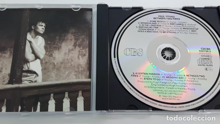 CDs de m&uacute;sica: CD PAUL YOUNG - BETWEEN TWO FIRES - Foto 2