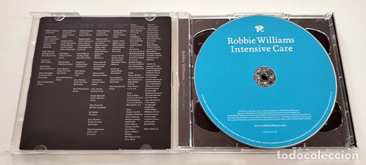 CDs de m&uacute;sica: CD Y DVD ROBBIE WILLIAMS. INTENSIVE CARE. COMO NUEVO. - Foto 3