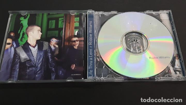 CDs de m&uacute;sica: CD ROBBIE WILLIAMS - LIFE THRU A LENS - Foto 2
