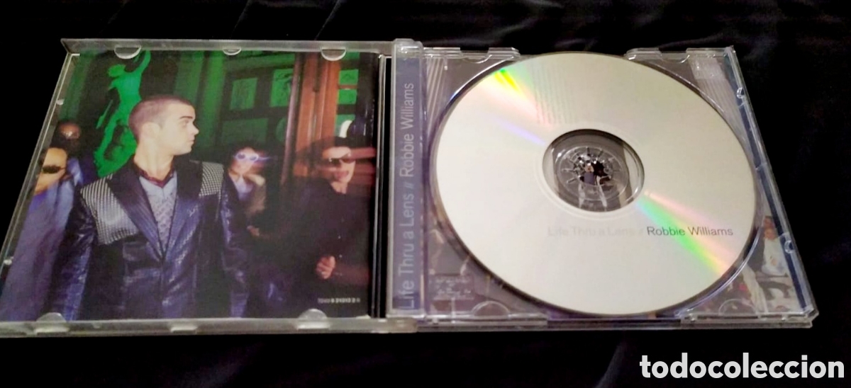 CDs de m&uacute;sica: Robbie williams life thru a lens - Foto 3