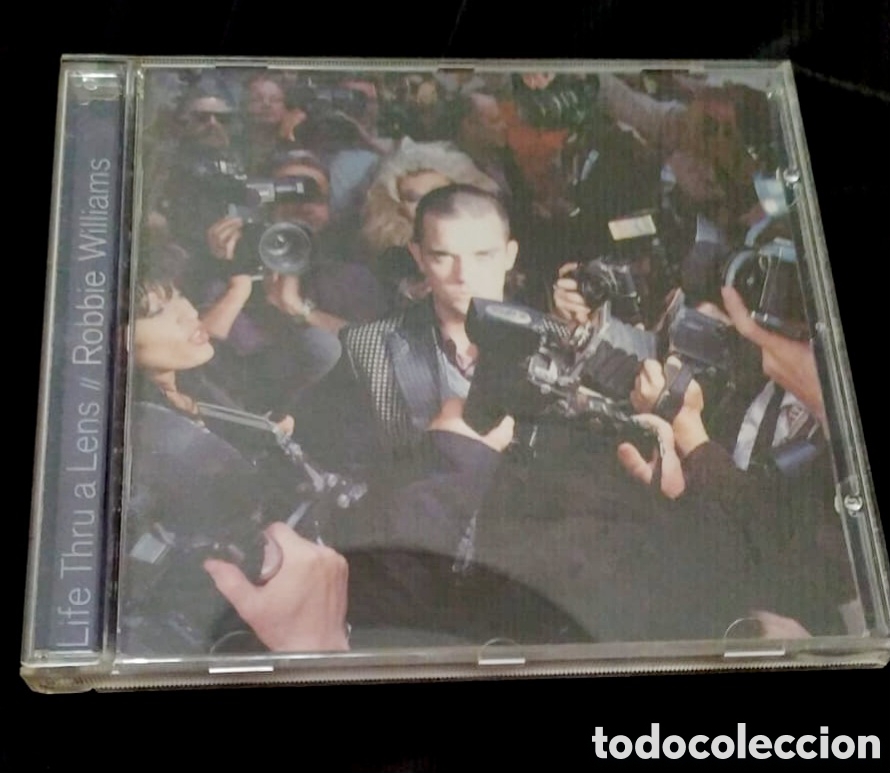 CDs de m&uacute;sica: Robbie williams life thru a lens - Foto 1