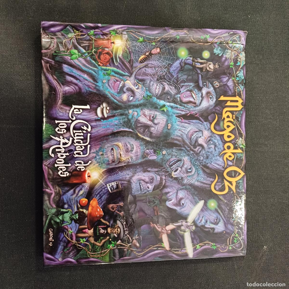 CDs de M&uacute;sica: MAGO DE OZ/LA CIUDAD DE LOS ARBOLES/CD LIBRO+DVD.