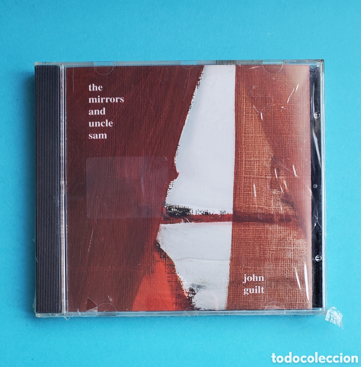 CDs de M&uacute;sica: Cd PRECINTADO.JOHN GUILT.THE MIRRORS AND UNCLE SAM.