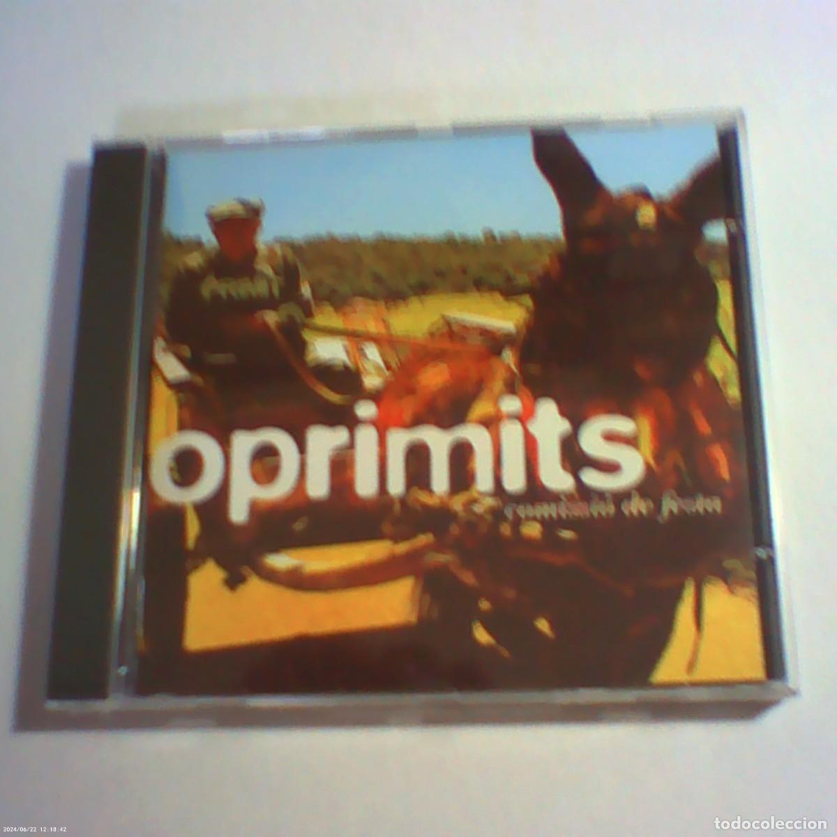CDs de M&uacute;sica: cd oprimits. comissi&oacute; de festa. disc medi 2002 cat. 12 temes. llibret (bon estat)