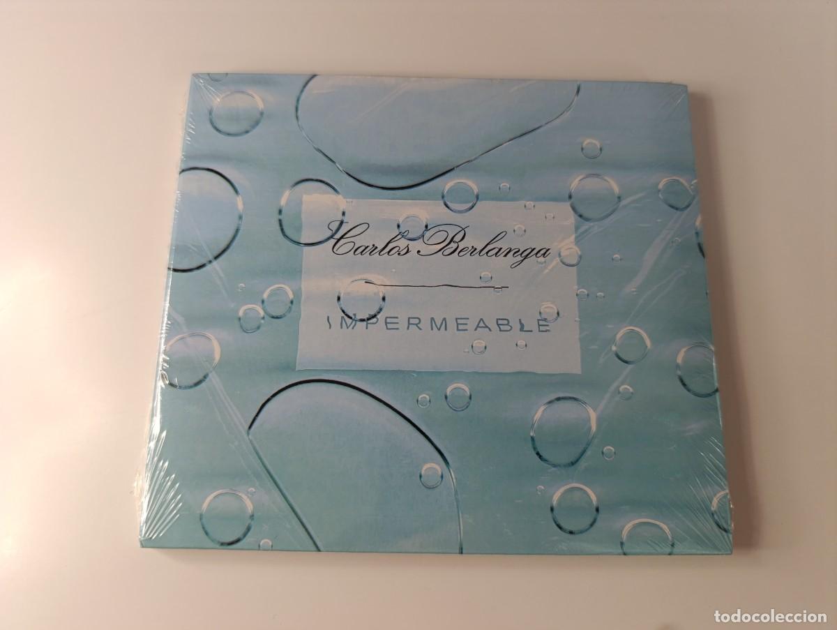 CDs de m&uacute;sica: CARLOS BERLANGA 'Impermeable' CD &Aacute;lbum 2001 NUEVO Precintado Elefant Records vacaciones