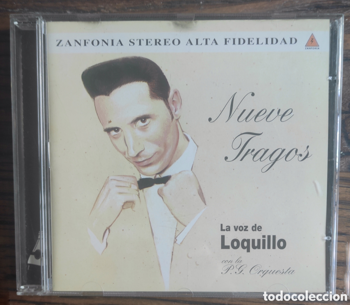 CDs de m&uacute;sica: ​CD La voz de Loquillo con la P.G. Orquesta - Nueve Tragos (1999)