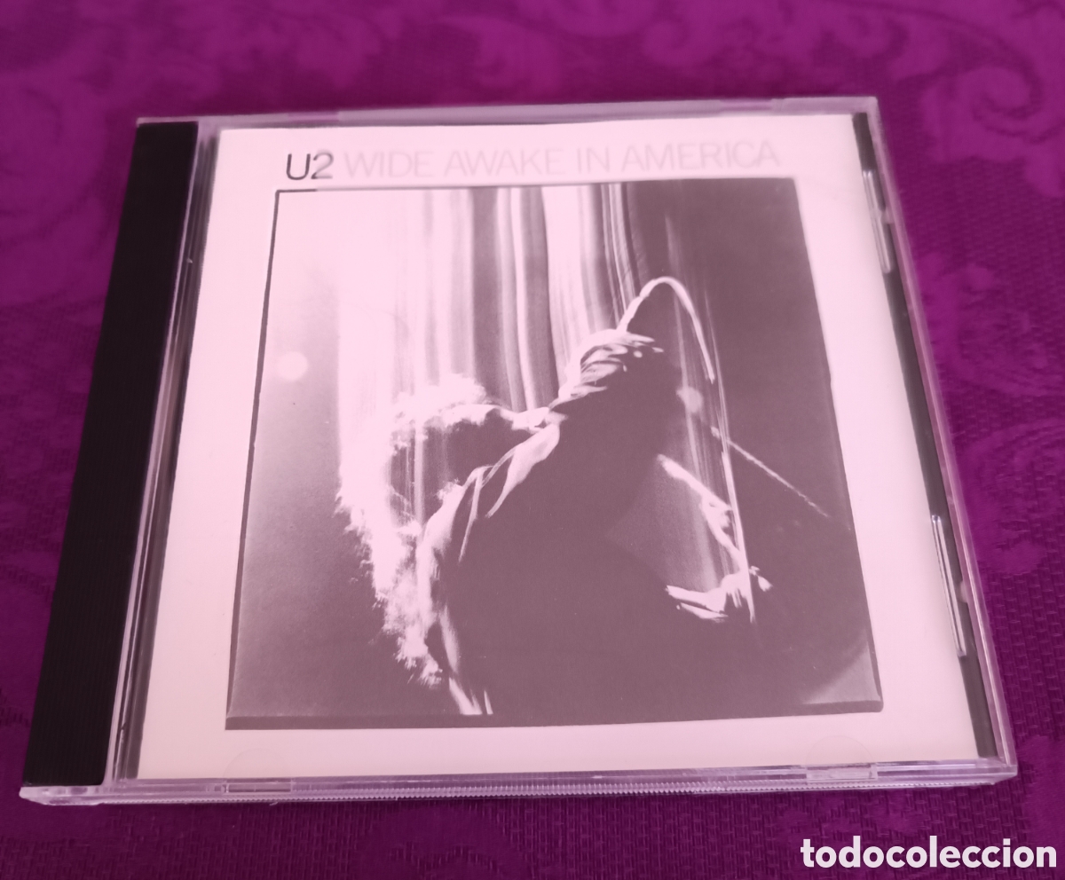 Music CDs: U2. WIDE AWAKE IN AM&Eacute;RICA 1984
