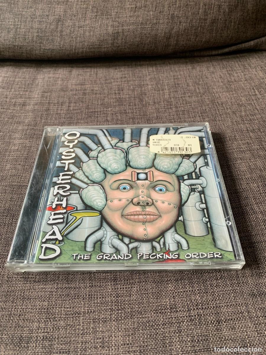 CDs de m&uacute;sica: CD. OYSTERHEAD. THE GRAND PECKING...INCLUYE LIBRILLO. BUENA CONSERV. PEDIDO MINIMO 10 EUROS.