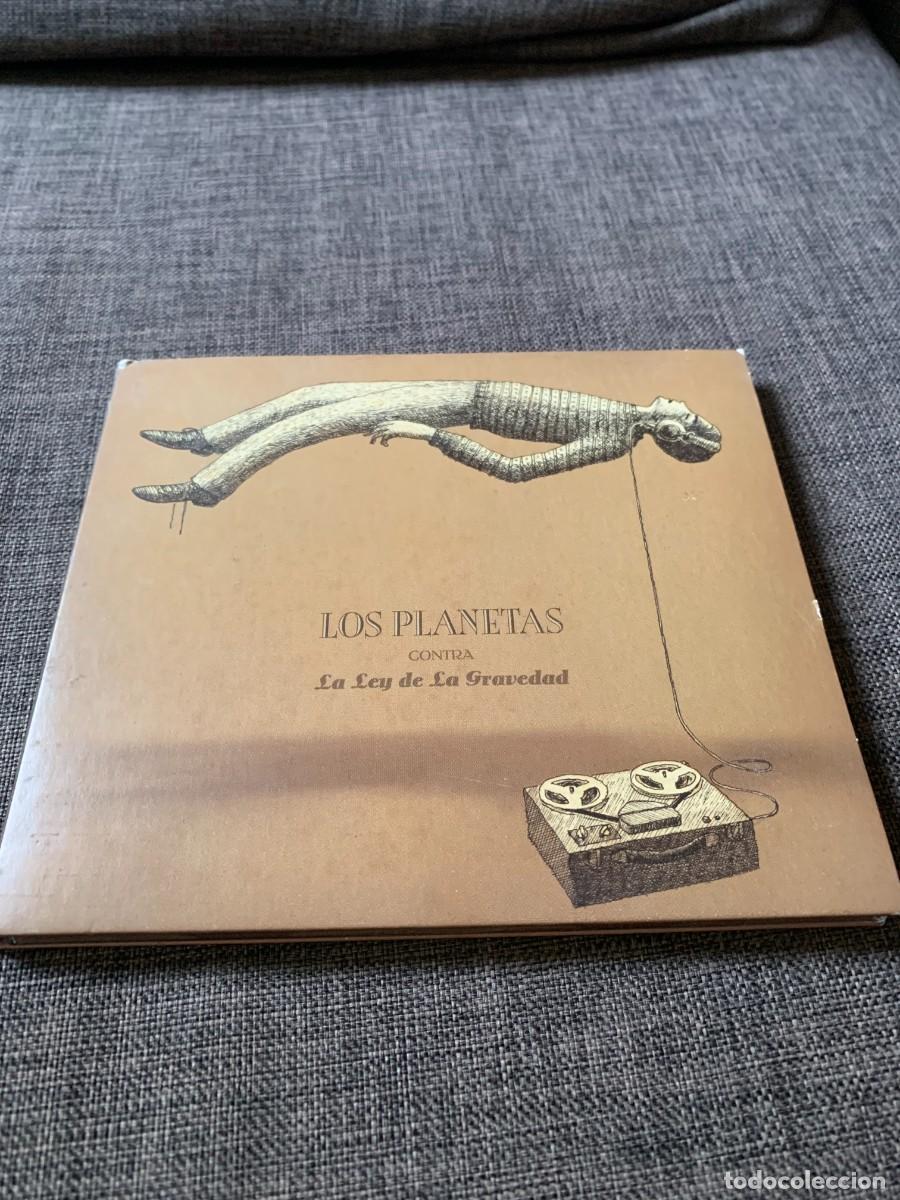 CDs de m&uacute;sica: CD DIGIPACK. LOS PLANETAS. LEY GRAVEDAD. LIBRILLO. BUENA CONSERV. PEDIDO MINIMO 10 EUROS.