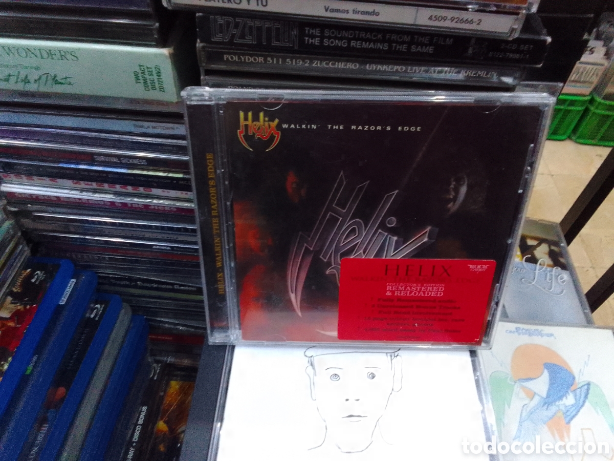 CDs de m&uacute;sica: Helix, walking the razor,s edge