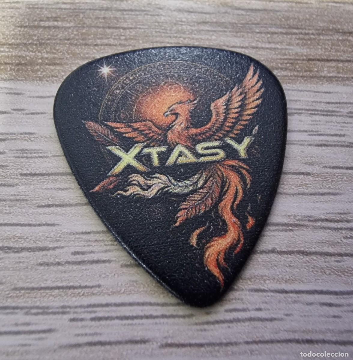 M&uacute;sica de colecci&oacute;n: XTASY PUA/GUITAR PICK LOGO PHOENIX 2026 CARLES SALSE